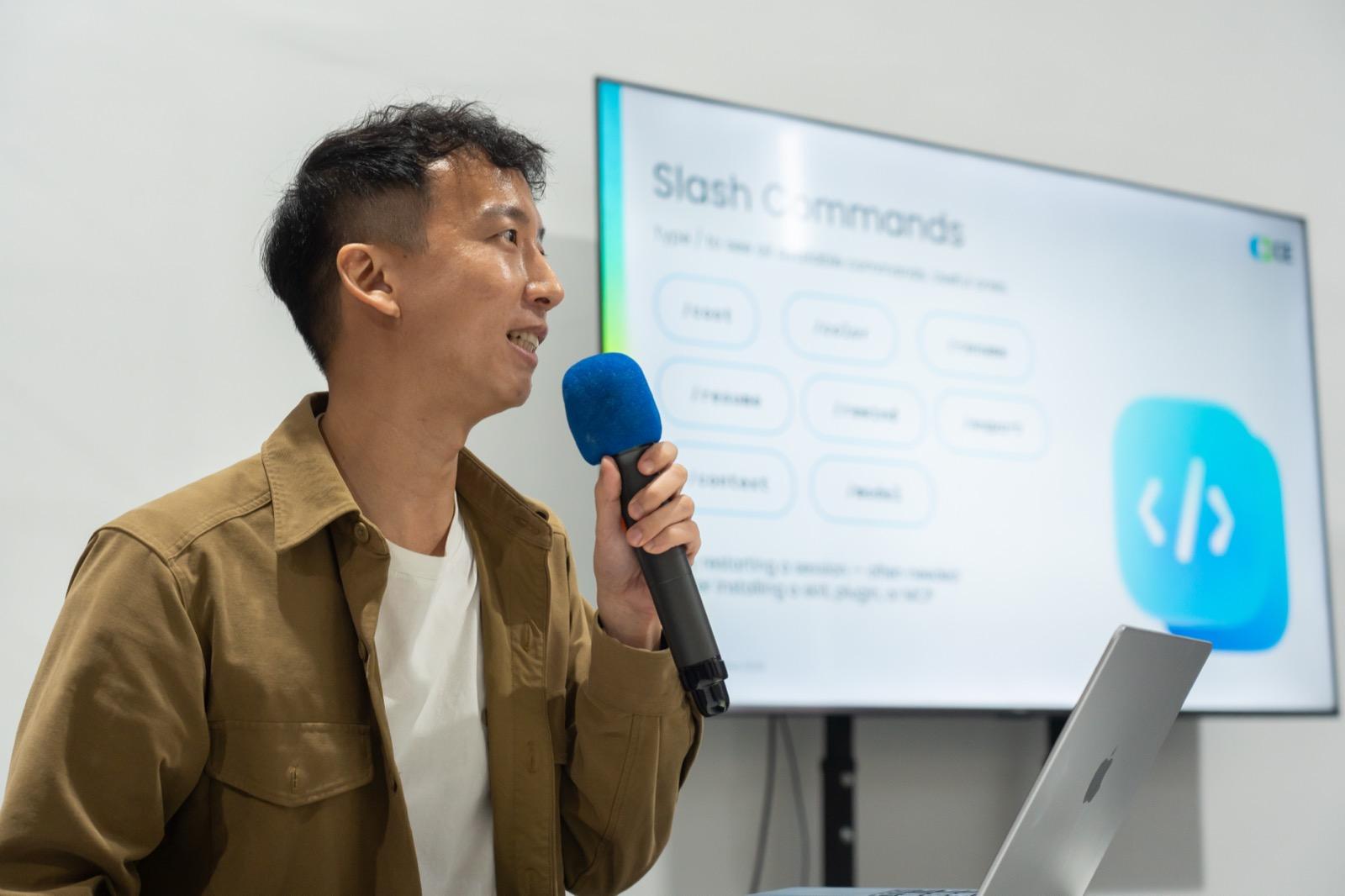 Trainer presenting with mic